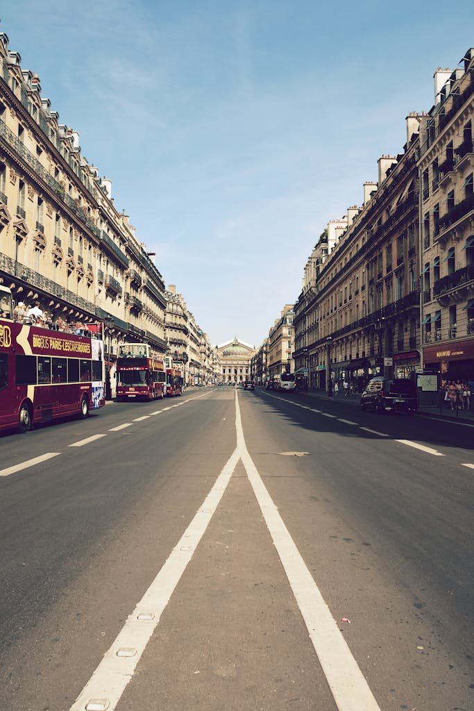 41 best Things to Do in Paris: Iconic Sights to Hidden Gems 11 Wide-open Paris street with iconic architecture under a clear sky. Ideal for urban and travel themes.