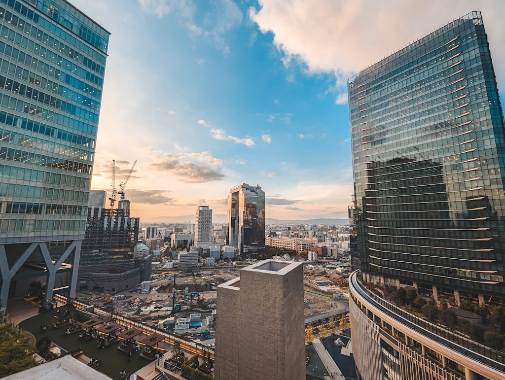 A breathtaking cityscape of Osaka, Japan showcasing skyscrapers at sunset.