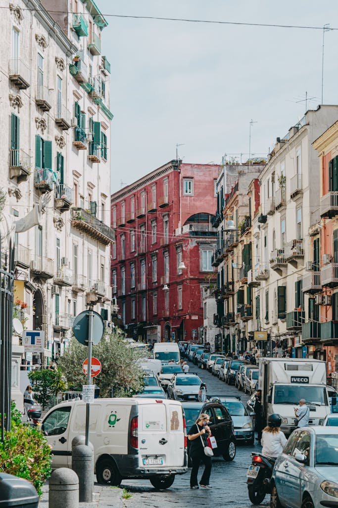 Is Naples Worth Visiting? 15 Pros and 5 Cons 13 A lively street scene in Naples, capturing the vibrant urban life and historic architecture.