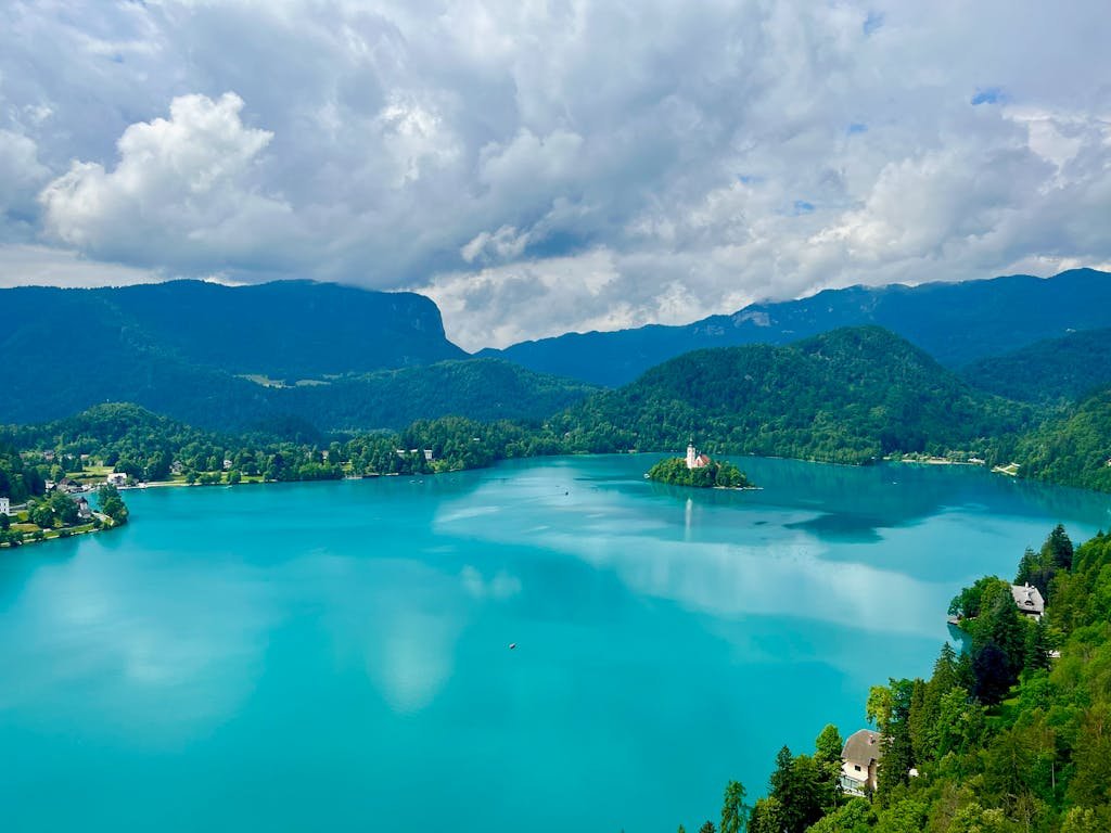 A stunning aerial view of Lake Bled with its iconic island and lush green surroundings in Slovenia.