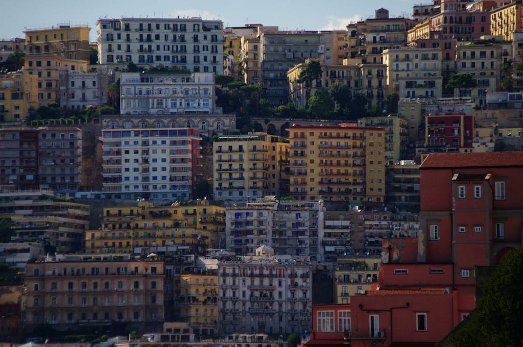 A vibrant view of colorful apartment buildings in Naples, showcasing urban architecture.
