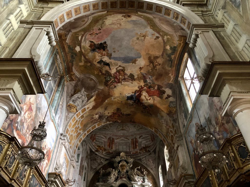 Captivating frescoed ceiling inside a historic church in Lombardy, Italy.