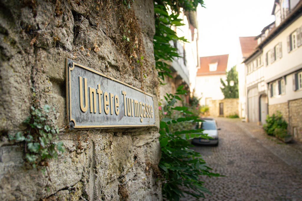 Cobblestone street view with Untere Turmgasse sign in Bad Wimpfen, Germany.