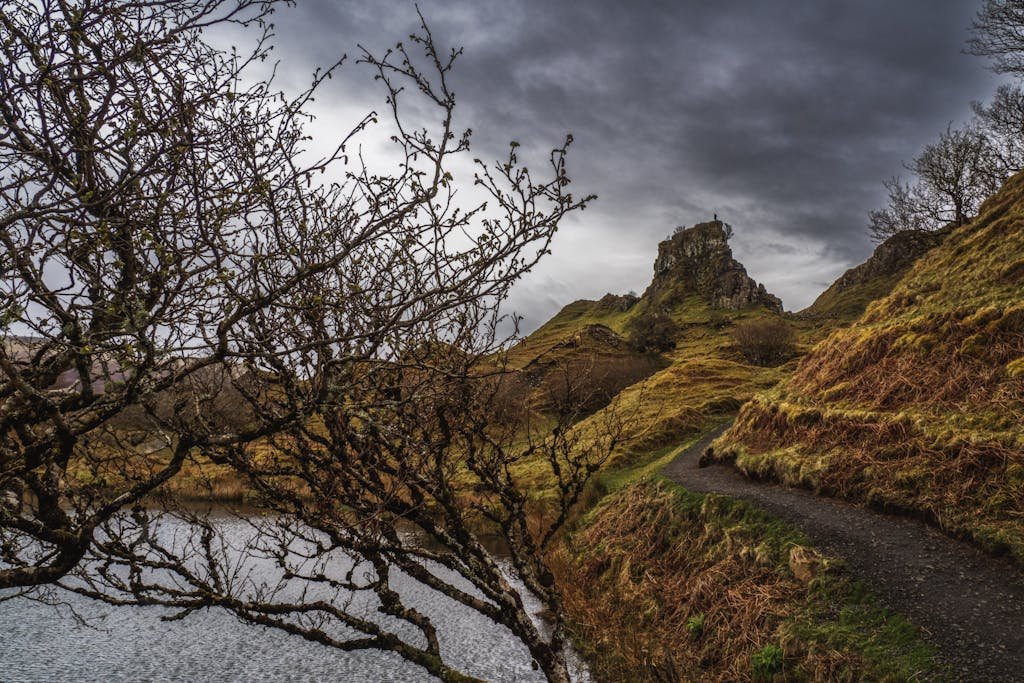 7 Day Scotland Road Trip Itinerary for First Timers 27 Dramatic landscape view of Fairy Glen on the Isle of Skye under overcast skies.