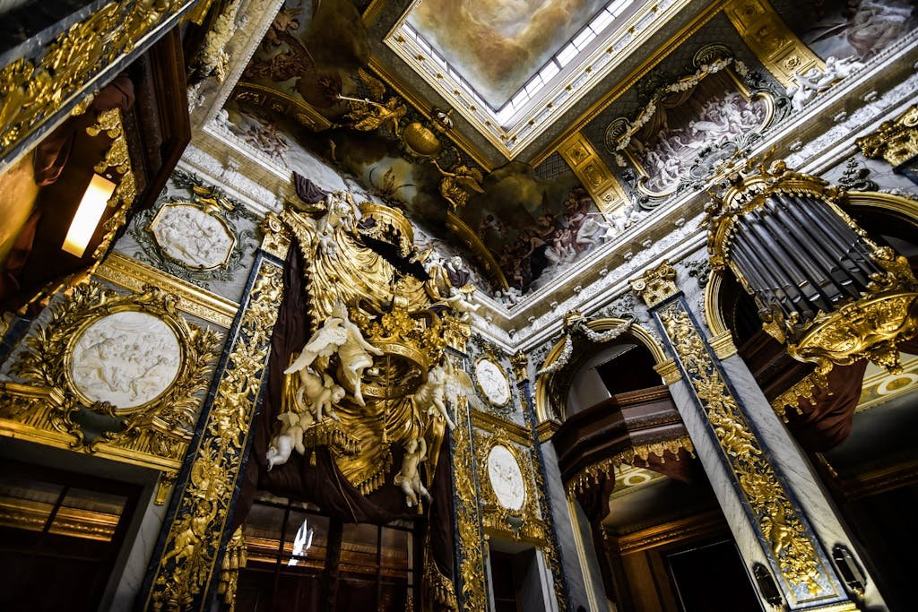 Intricate Baroque architecture with lavish gold details in a grand European palace interior