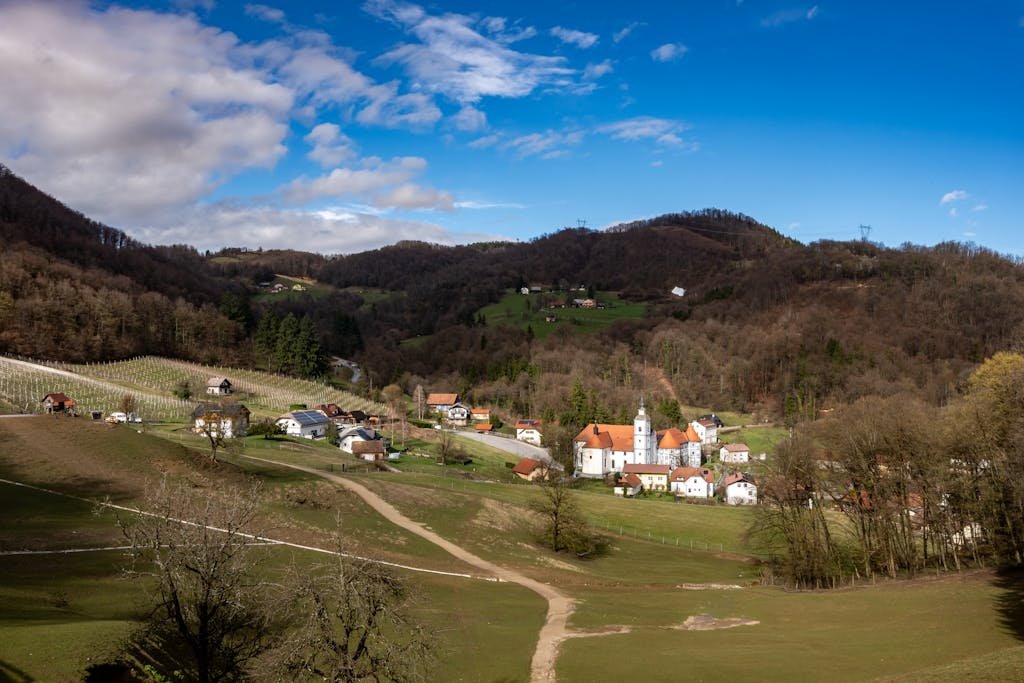 Picturesque landscape of Šmarje pri Jelšah with rolling hills and a traditional church.