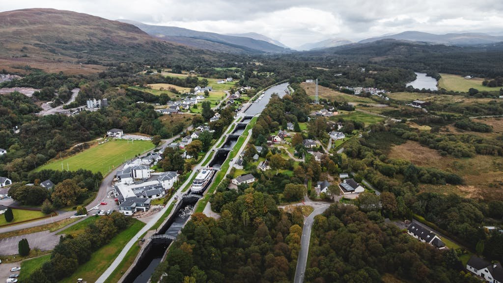 7 Day Scotland Road Trip Itinerary for First Timers 31 Scenic aerial photograph showcasing Fort William's landscape with locks and lush greenery in Scotland.