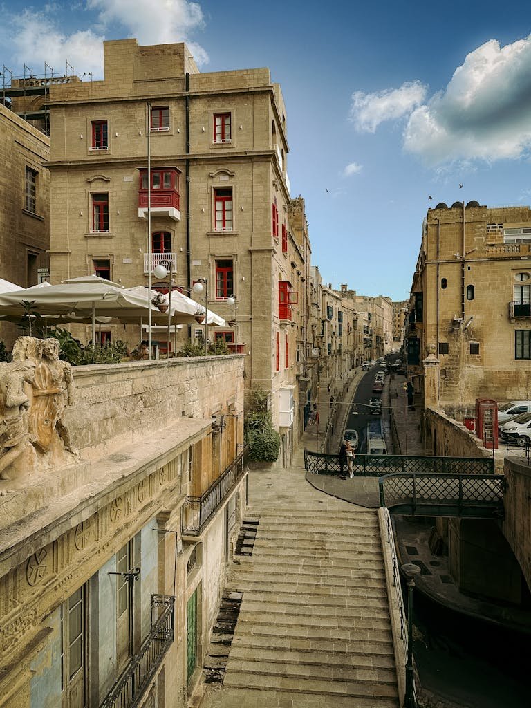 Is Malta Expensive? My Malta Budget Breakdown 2026 2 Scenic urban landscape of Valletta, showcasing historic architecture and vivid sky.