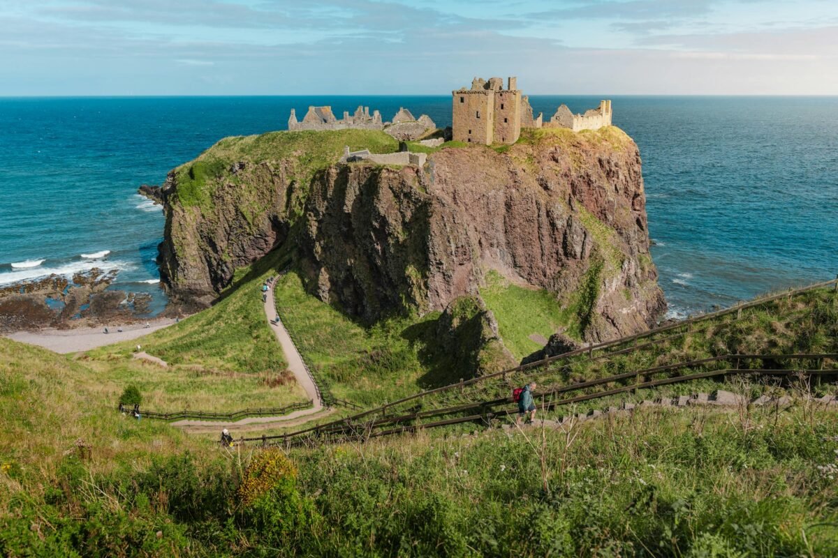 Scenic view of Dunnottar Castle perched on a cliff overlooking the North Sea in Scotland.