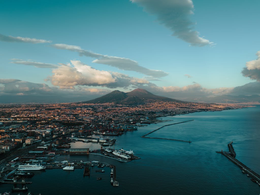 Stunning aerial panorama of Naples, Italy, showcasing the vibrant port and iconic Mount Vesuvius.