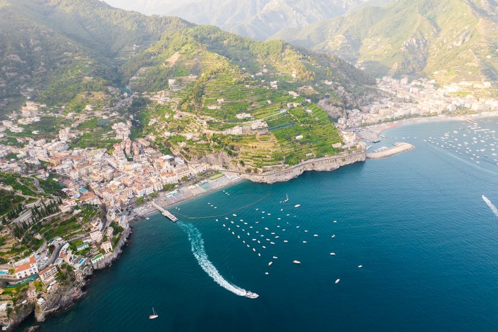 Stunning aerial view of Amalfi coastline, showcasing the vibrant landscape and serene sea.