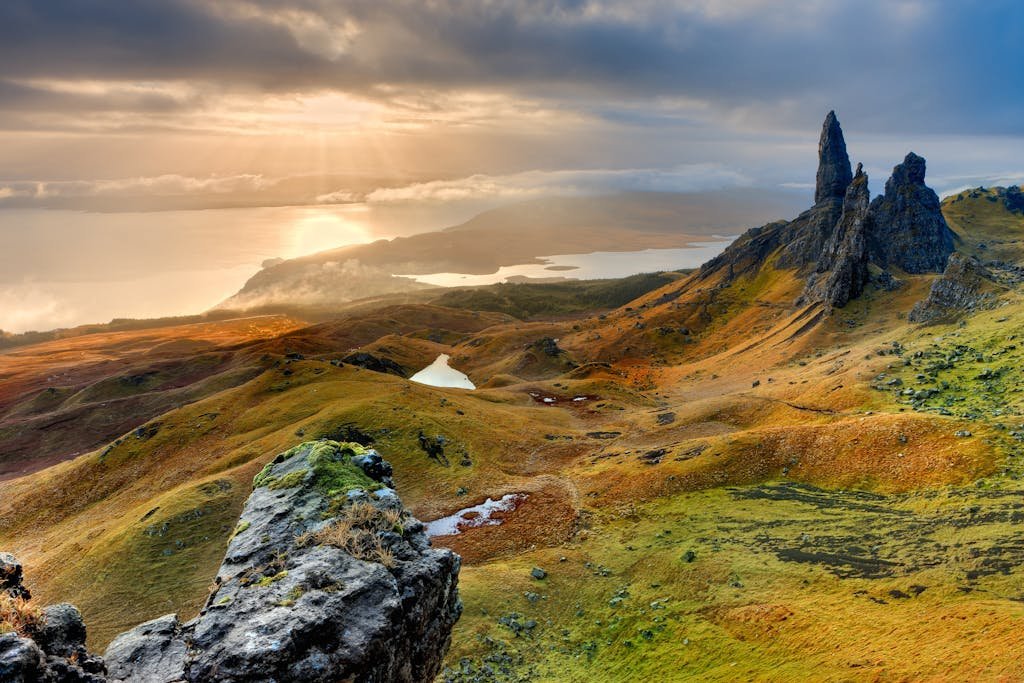 7 Day Scotland Road Trip Itinerary for First Timers 25 Stunning sunrise at Old Man of Storr in Scotland, highlighting rocky peaks and lush landscapes.