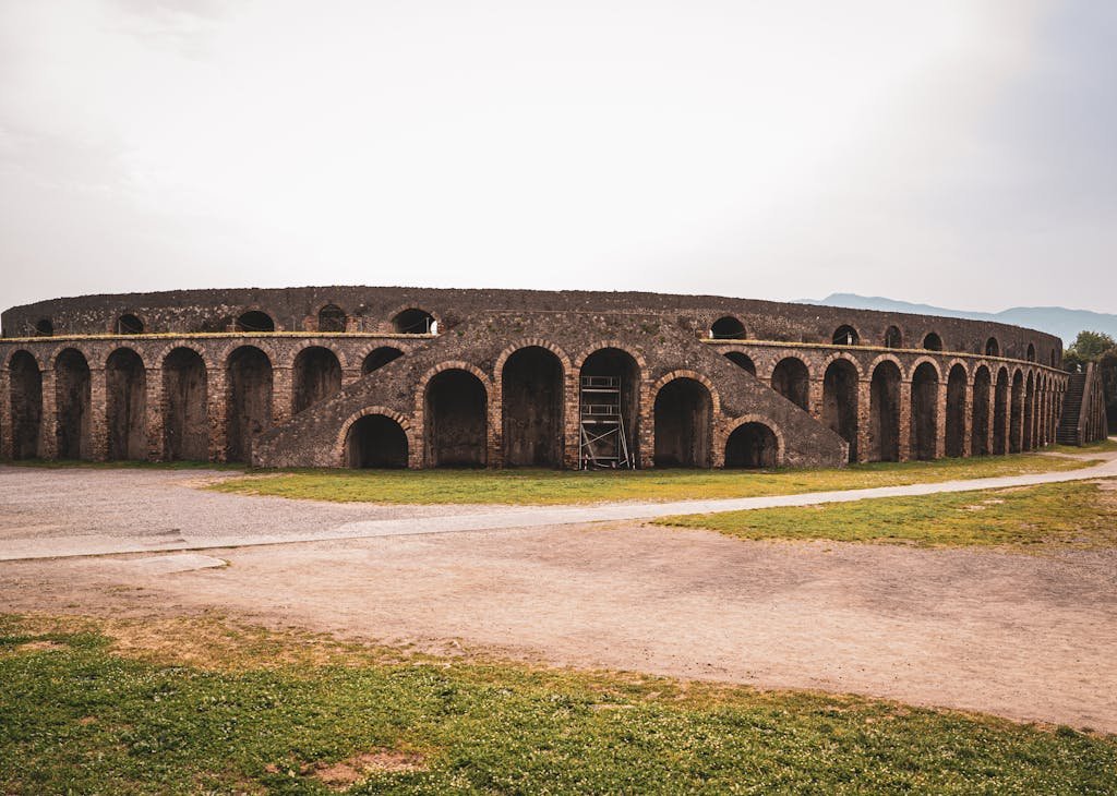 Is Naples Worth Visiting? 15 Pros and 5 Cons 10 Stunning view of the well-preserved Roman amphitheater in Pompeii, Italy.