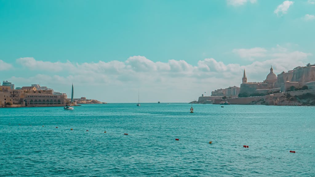 Tranquil seascape showcasing Malta's stunning historic harbor with vibrant blue waters.