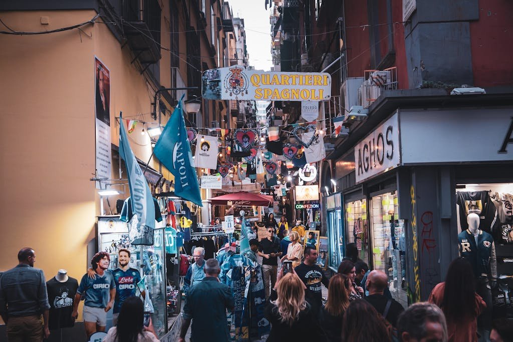 Vibrant street market in Quartieri Spagnoli, Naples with shoppers and colorful displays. one of the best things to do in naples italy
