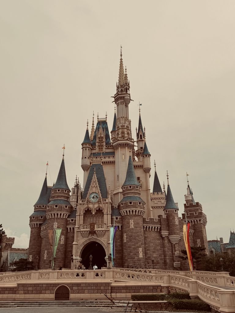 19 Best Things to Do in Shibuya, Tokyo: Food, Shopping & Tips 9 A vintage-style photo of the iconic castle at Tokyo Disneyland on a clear day.