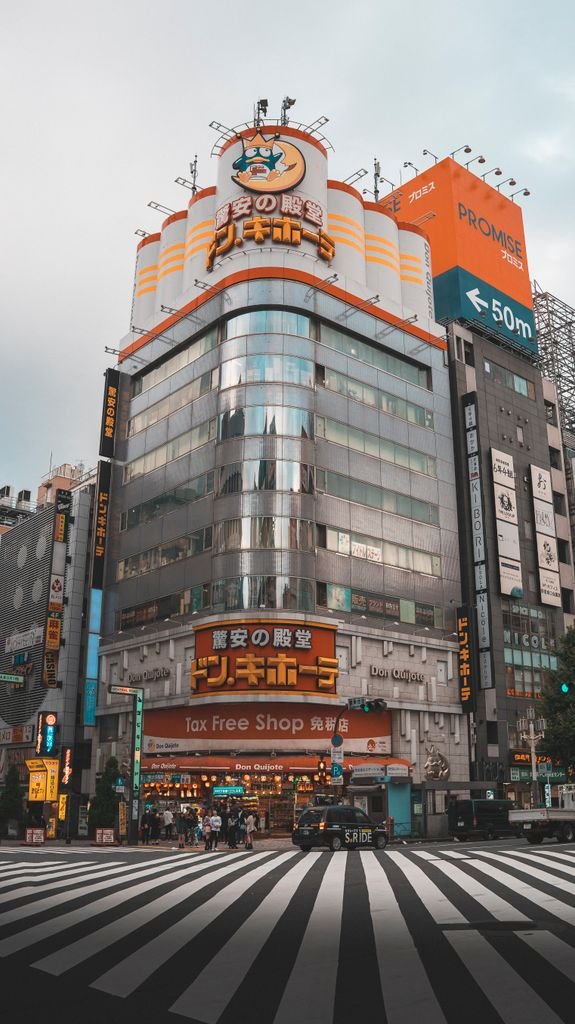 19 Best Things to Do in Shibuya, Tokyo: Food, Shopping & Tips 5 Bustling Shinjuku street with iconic architecture and lively atmosphere in Tokyo, Japan.