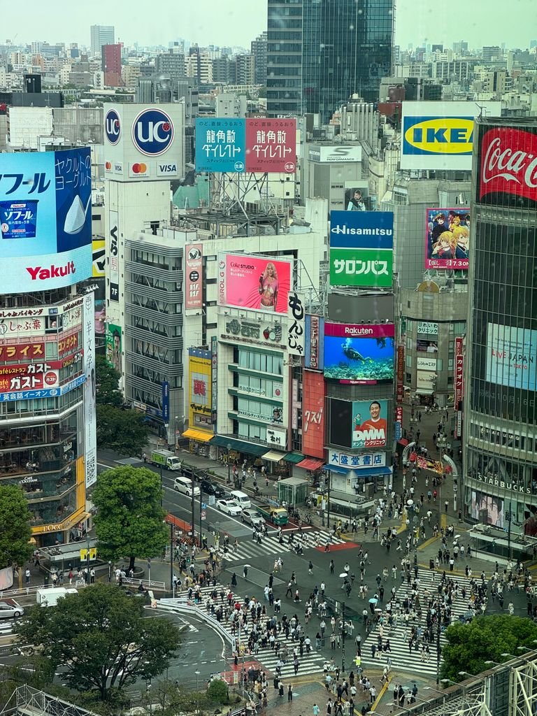19 Best Things to Do in Shibuya, Tokyo: Food, Shopping & Tips 3 Busy and vibrant view of Shibuya Crossing in Tokyo with bustling crowds and iconic billboards.