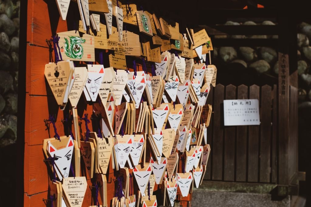Ema plaques with fox motifs at Fushimi Inari Shrine in Kyoto, Japan.
