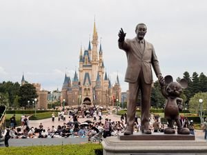 Tokyo Disneyland Guide: Best Rides, Tickets & One-Day Itinerary 5 Statue of Walt Disney and Mickey Mouse in front of Cinderella Castle, Tokyo Disneyland.