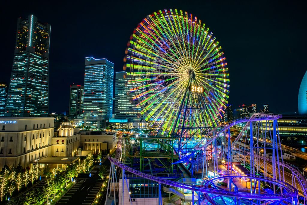 Universal Studios Japan: The Complete Guide for First-Time Visitors 5 Vibrant night view of Yokohama's Cosmo Clock 21 Ferris wheel in Japan's urban cityscape.