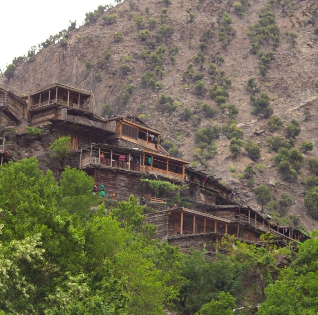 Kalash Valley Travel Guide 2026: Kalash Festivals, Culture & People 7 Scenic view of Kalash Valley surrounded by the Hindu Kush Mountains