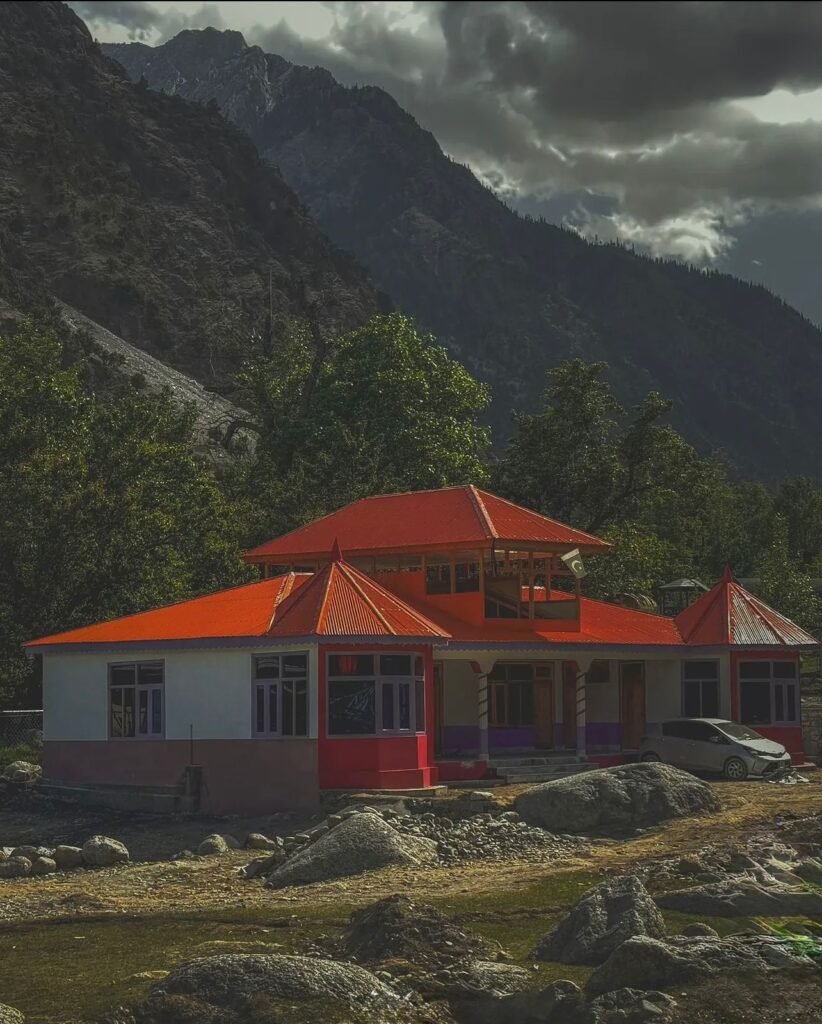 Kalash Valley Travel Guide 2026: Kalash Festivals, Culture & People 4 Traditional Kalash houses with orange roofs built on the hillside