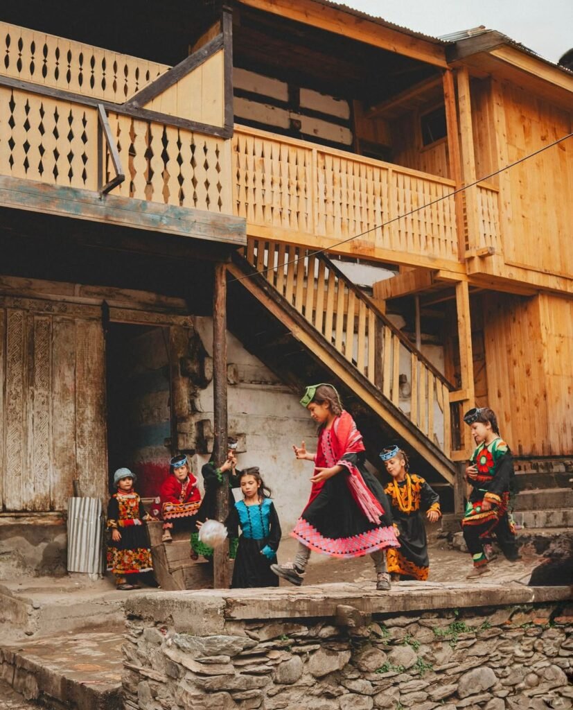 Kalash Valley Travel Guide 2026: Kalash Festivals, Culture & People 5 Traditional wooden houses in a Kalash village